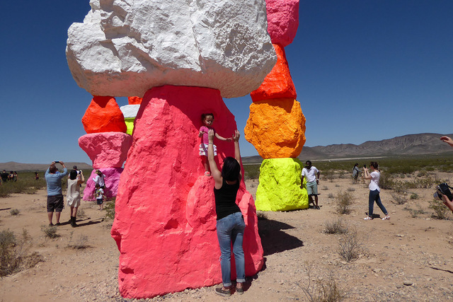 People explore the area at Seven Magic Mountains near Jean, Nev. on Sunday, May 22, 2016. (Jane Ann Morrison/Las Vegas Review-Journal)