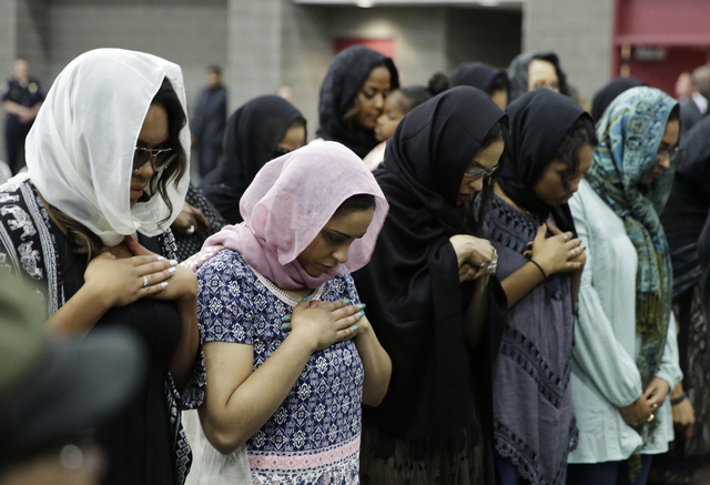Women pray during Muhammad Ali's Jenazah, a traditional Islamic Muslim service, in Freedom Hall, Thursday, June 9, 2016, in Louisville, Ky. (David Goldman/AP)