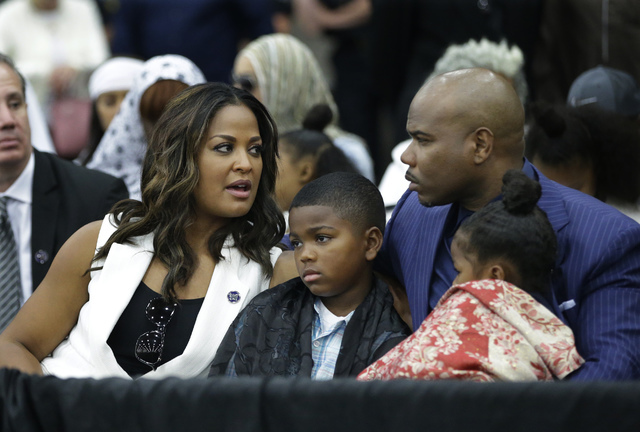 Laila Ali speaks to her husband Custis Conway during Muhammad Ali's Jenazah, a traditional Islamic Muslim service, in Freedom Hall, Thursday, June 9, 2016, in Louisville, Ky. (Darron Cummings/AP)