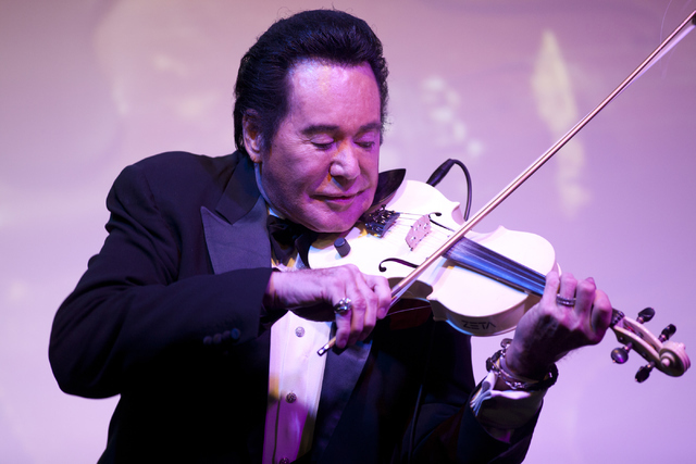 Wayne Newton plays the violin during his show &quot;Up Close And Personal&quot; on Thursday, June 16, 2016 at the Bally's hotel-casino in Las Vegas. Loren Townsley/Las Vegas Review-Journal ...