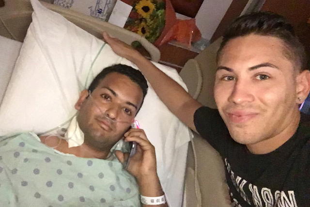 In this photo released by Joseph Rivera, Felipe Marrero, 30, left, poses in his hospital bed in Orlando, Fla., Monday, June 13, 2016, in this image taken by his friend Joseph Rivera, 34, right. Ri ...