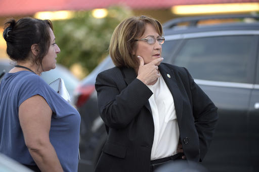 Orange County Mayor Teresa Jacobs, right, is briefed after arriving to the scene of a fatal shooting at Pulse Orlando nightclub in Orlando, Fla., Sunday, June 12, 2016. (Phelan M. Ebenhack/AP Photo)