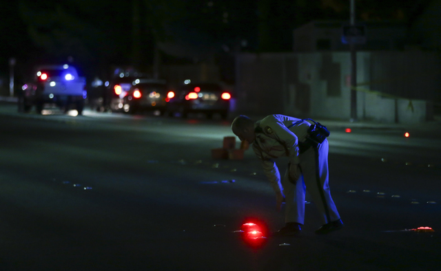 Las Vegas police block off Torrey Pines Drive near Lake Mead Boulevard as a barricade situation goes on in a nearby apartment complex in Las Vegas on Wednesday, June 29, 2016. A homicide occurred  ...