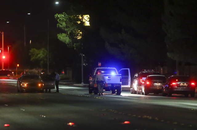Las Vegas police block off Torrey Pines Drive near Lake Mead Boulevard as a barricade situation goes on in a nearby apartment complex in Las Vegas on Wednesday, June 29, 2016. A homicide occurred  ...