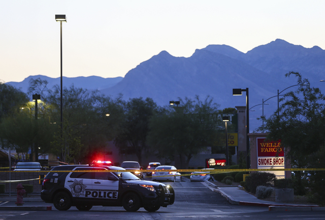 Las Vegas police investigate the homicide of Phoukeo Dej-Oumond, outside a Walgreens at Lake Mead and Jones boulevards in Las Vegas on Wednesday, June 29, 2016. Chase Stevens/Las Vegas Review-Jour ...