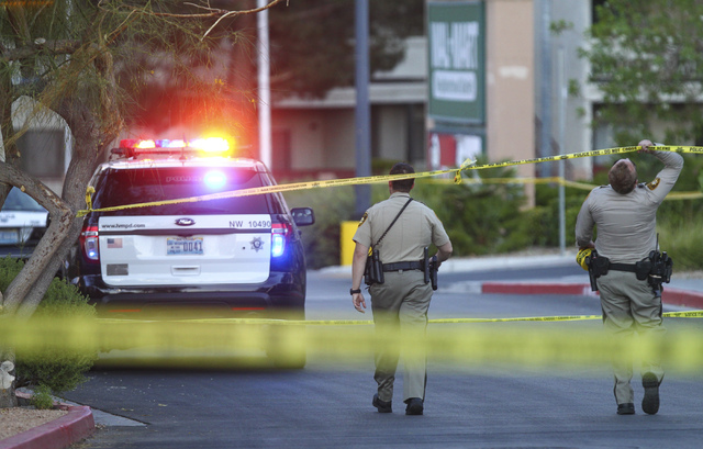 Las Vegas police investigate a homicide outside a Walgreens at Lake Mead and Jones boulevards in Las Vegas on Wednesday, June 29, 2016. Chase Stevens/Las Vegas Review-Journal Follow @csstevensphoto