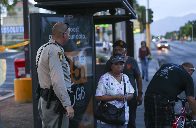 Las Vegas police shut down a sidewalk and bus stop while investigating a homicide outside of a Walgreens at Lake Mead and Jones Boulevards in Las Vegas on Wednesday, June 29, 2016. (Chase Stevens/ ...