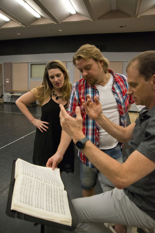 Soprano Suzanne Vinnik, left, and tenor Viktor Antipenko consult with conductor Gregory Buchalter during a rehearsal for Opera Las Vegas' "Carmen," which opens Friday at UNLV's Judy Bayley Theatre ...