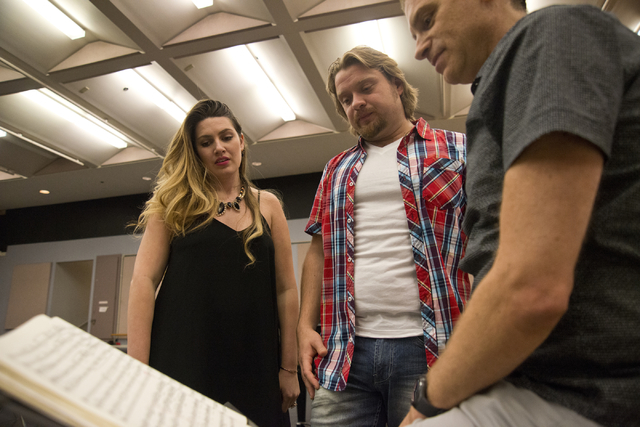 Performers Suzanne Vinnik, left, and Viktor Antipenko, center, speak with conductor Gregory Buchalter during rehearsals for Opera Las Vegas' production of "Carmen" this weekend at UNLV. Daniel Cla ...