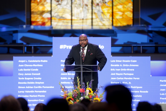 Bishop L. Kelvin Cobaris of Impact Church introduces the Orlando mayor at a service to honor victims of the Orlando nightclub shooting at the First Baptist Orlando Church in Orlando, Florida on Tu ...