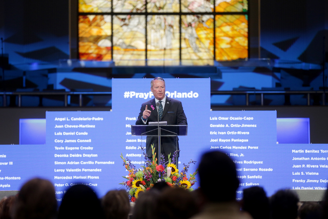 Orlando Mayor Buddy Dyer addresses attendees at a service to honor victims of the Orlando nightclub shooting at the First Baptist Orlando Church in Orlando, Florida on Tuesday, June 14, 2016. (Rac ...