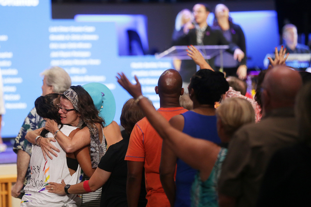 Eileen Vale hugs Beth Case at a service to honor victims of the Orlando nightclub shooting at the First Baptist Orlando Church in Orlando, Florida on Tuesday, June 14, 2016. (Rachel Aston/Las Vega ...