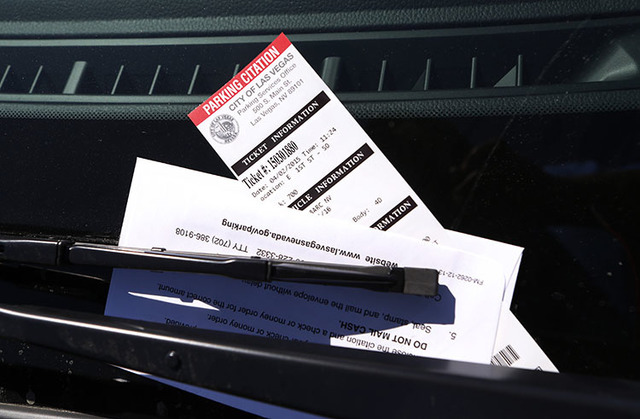 A parking ticket is shown tucked under the windshield wiper of a car Thursday, April 2, 2015, on E. 1st street in downtown Las Vegas. (Bizuayehu Tesfaye/Las Vegas Review-Journal) Follow Bizuayehu  ...