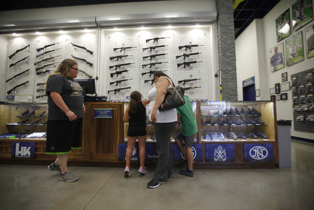 The Ramirez-Lang family looks at guns at The Range 702 store in Las Vegas on Monday, June 20, 2016. Rachel Aston/Las Vegas Review-Journal Follow @rookie__rae