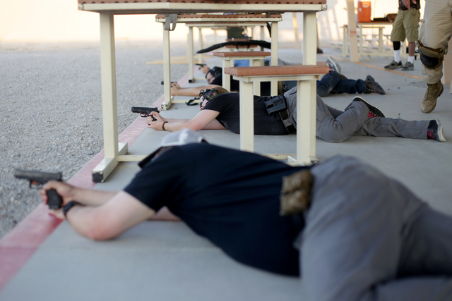 Class participants practice the prone bent leg position on Friday, June 24, 2016 at the Clark County Shooting Complex in Las Vegas. Rachel Aston/Las Vegas Review-Journal Follow @rookie__rae