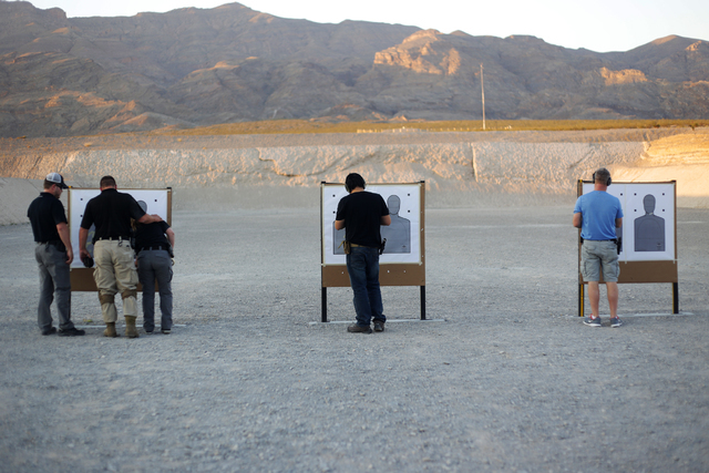 Class participants tape off their shots on their shooting targets on Friday, June 24, 2016 at the Clark County Shooting Complex in Las Vegas. Rachel Aston/Las Vegas Review-Journal Follow @rookie__rae