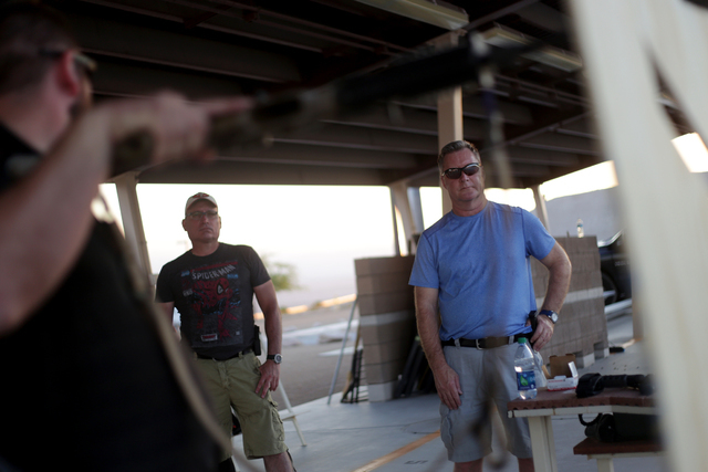 A.J. Clark, an Adapt instructor, shows Joe Fishinghawk and Lynn Norman how to use a barricade wall on Friday, June 24, 2016 at the Clark County Shooting Complex in Las Vegas. Fishinghawk and Norma ...