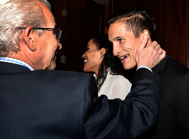 Biaggio Ali Walsh, right, is hugged by his father, Bob Walsh, before the Best of Nevada Preps awards banquet at the Red Rock hotel-casino Saturday, June 4, 2016, in Las Vegas. (David Becker/Las Ve ...