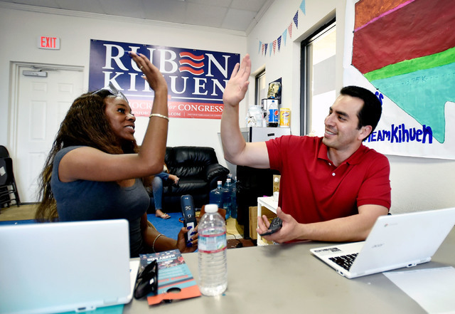 Democratic congressional candidate Ruben Kihuen, right, gets a high-five from volunteer Avyon Pearson after a successful phone call at a campaign office Tuesday, June 14, 2016, in Las Vegas. David ...