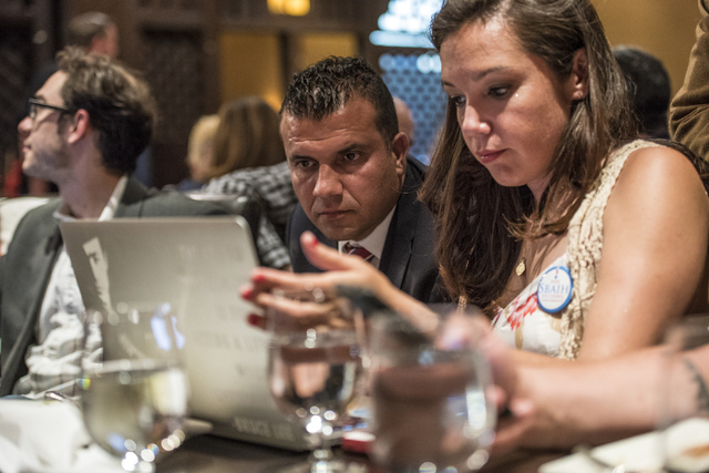 Democratic Congressional District 3 candidate Jesse Sbaih, left, and Angie Morelli, Sbaih's campaign manager, look at election results during a campaign event at Origin India Restaurant in Las Veg ...