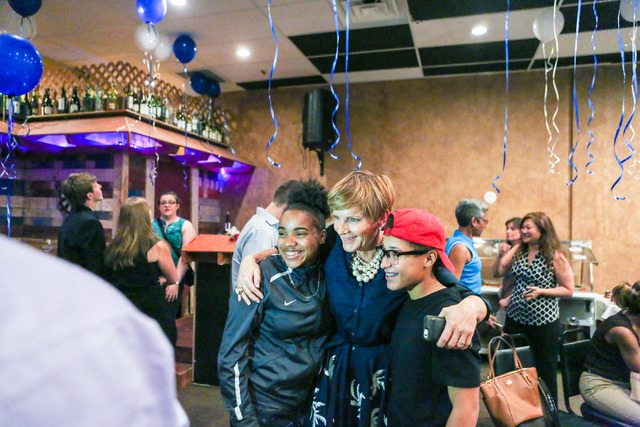 Democratic Congressional District 4 candidate Susie Lee gets a photo taken with her high school interns after losing  primary elections during her election watch party at Saffron Flavors of India  ...
