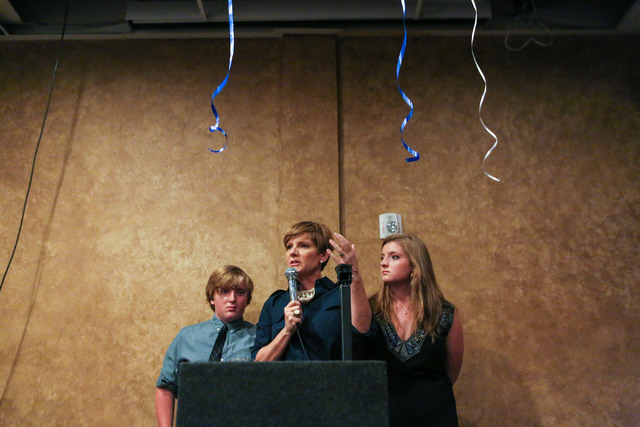 Democratic Congressional District 4 candidate Susie Lee shares a story of door to door campaigning tearfully with her son Cody Lee, left, and daughter Nevada Lee, right, after losing primary elect ...