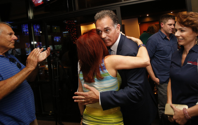 Republican Congressional District 3 candidate Danny Tarkanian embraces a supporter during his election night gathering at Born and Raised in Las Vegas on Tuesday, June 14, 2016. (Richard Brian/Las ...