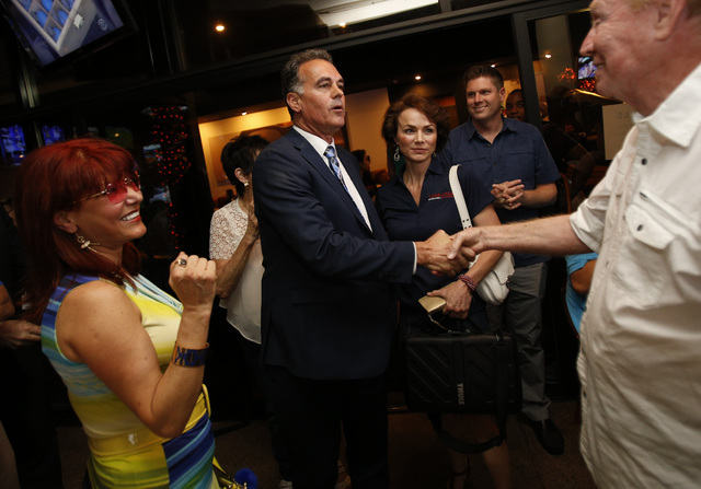 Republican Congressional District 3 candidate Danny Tarkanian, left, is greeted by Norm Ross during his election night gathering at Born and Raised in Las Vegas on Tuesday, June 14, 2016. (Richard ...