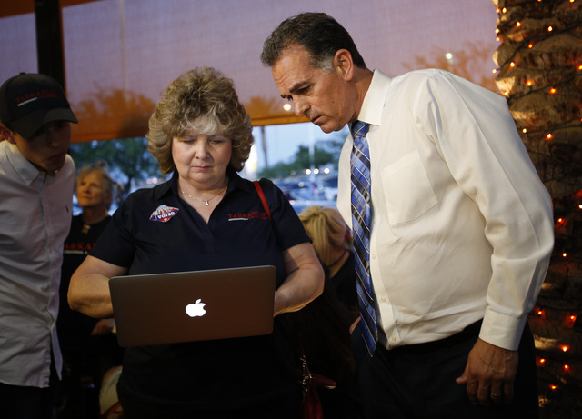 Republican Congressional District 3 candidate Danny Tarkanian, left, looks at campaign results with campaign assistant Judy Flynn during his election night gathering at Born and Raised in Las Vega ...
