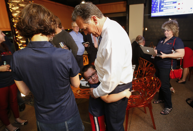 Republican Congressional District 3 candidate Danny Tarkanian hugs his son Jerry, 6, during his election night gathering at Born and Raised in Las Vegas on Tuesday, June 14, 2016. (Richard Brian/L ...