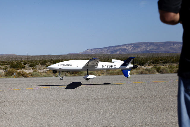 Sandstorm, an experimental unmanned aircraft system manufactured by Unmanned Systems, Inc., is piloted in for a landing by Michael Toland of National Security Technologies at the Desert Rock Airpo ...