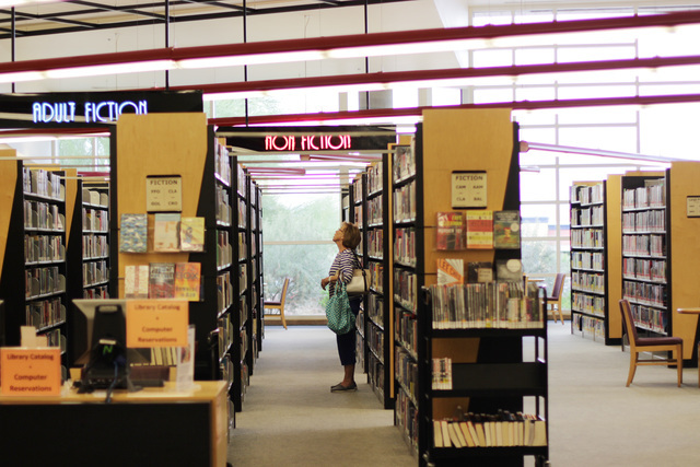 Connie Wilson of Las Vegas scans the bookshelves at the Rainbow branch of the Las Vegas-Clark County Library district on June 18, 2016. (Adelaide Chen/Las Vegas Review-Journal)