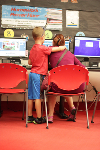 A child shares a moment with his mother while playing on the computers at the Rainbow branch library of the Las Vegas-Clark County Library District on June 18, 2016. (Adelaide Chen/Las Vegas-Revie ...