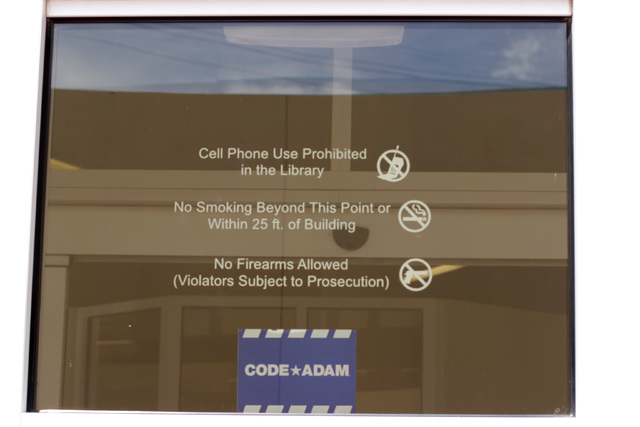 While the Henderson Libraries allow gun owners to open carry based on the interpretation of state law by city police, the Las Vegas-Clark County Library District does not. Photo taken June 18, 201 ...