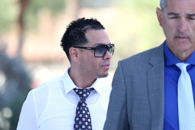 Ernesto Ramos, left, walks to the Lloyd George U.S. Courthouse in Las Vegas with his attorney Gabriel Grasso to plead guilty to an extortion charge Tuesday, Nov. 3, 2015. (Erik Verduzco/Las Vegas  ...