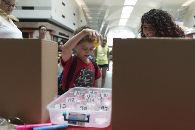 Anthony Schattilly, 7, drops a ball into a cup during the Clark County School District's Reading Rangers program kick off at the Boulevard Mall in Las Vegas Saturday, June 11, 2016. Jason Ogulnik/ ...