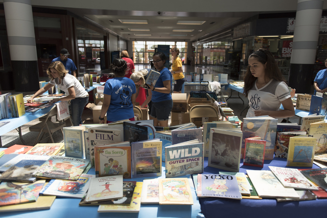 Tables with books that are given away as prizes for completing activities during the Clark County School District's Reading Rangers program kick off at the Boulevard Mall in Las Vegas Saturday, Ju ...