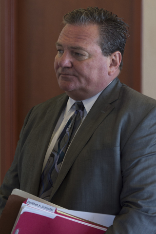 Louis C. Schneider, attorney for Desert Pines High School teacher Jonathan Scheaffer, speaks with a reporter following Scheaffer's court appearance at the Regional Justice Center in Las Vegas Mond ...