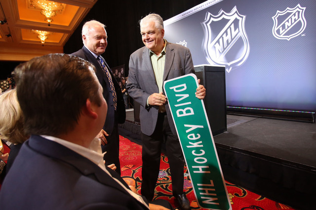 Commissioner Steve Sisolak with an NHL Hockey Blvd street sign on June 22, 2016. (Jeff Scheid/Las Vegas Review-Journal)