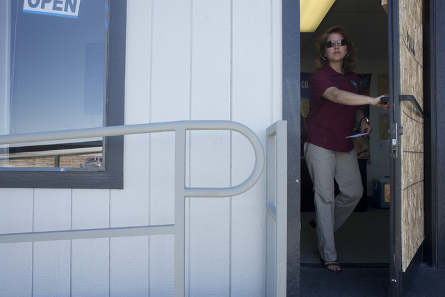 Lead Park Ranger Gina Mele exits the contact station at Sloan Canyon National Conservation Area in Henderson, Nev. on Friday, June 17, 2016. The contact station reopened Friday after vandalization ...