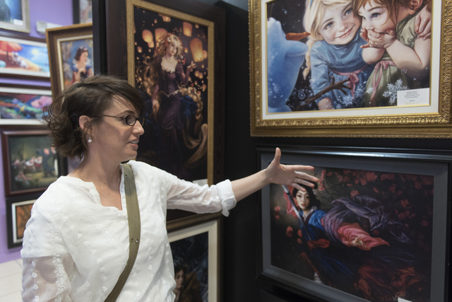Summerlin artist Heather Theurer gives a tour of her work, explaining her creative process, at Magical Memories featuring Disney Fine Art at Town Square Las Vegas May 23, 2016. Jason Ogulnik/View