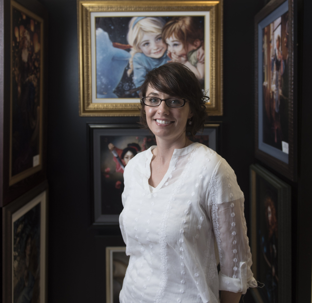 Artist Heather Theurer poses with her work in Magical Memories featuring Disney Fine Art at Town Square Las Vegas May 23, 2016. Jason Ogulnik/View