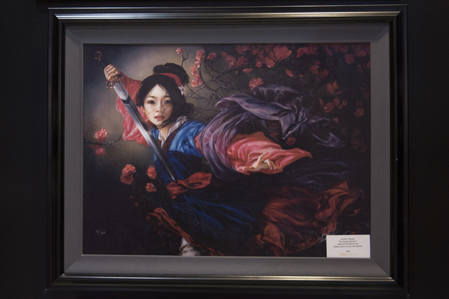 A limited-edition print of a painting by Heather Theurer hangs in Magical Memories featuring Disney Fine Art at Town Square Las Vegas May 23, 2016. Jason Ogulnik/View