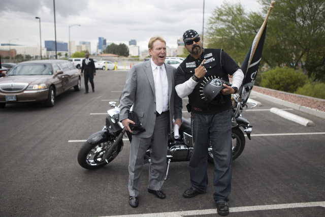 Oakland Raiders owner Mark Davis, left, poses with fan Eric Carrillo following press conference on the proposed Las Vegas dome stadium at the Stan Fulton Building at UNLV on Thursday, April 28, 20 ...