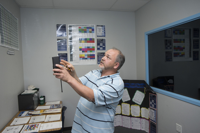 Douglas Trinkle, autism teacher at Variety School, shows recorded behavior logs for his students at Variety School on Tuesday, May 31, 2016, in Las Vegas. Trinkle was named the Outstanding Educati ...
