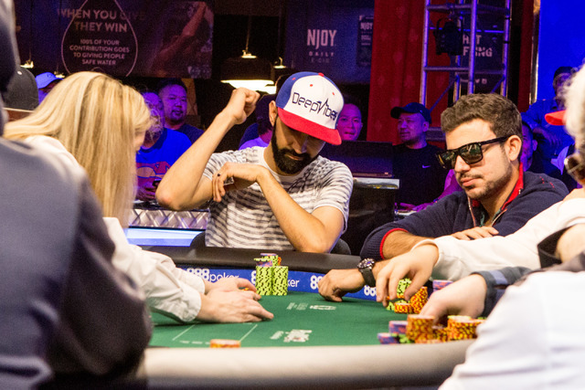 Andrew Moreno, center, plays in the final nine in the World Series of Poker "Monster Stack" event at the Rio Convention Center in Las Vegas on Tuesday, June 28, 2016. (Elizabeth Brumley/Las Vegas  ...