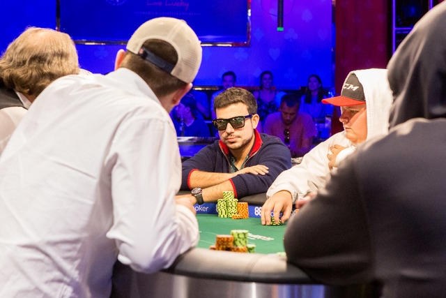 Dorian Rios, center, plays in the final nine in the World Series of Poker "Monster Stack" event at the Rio Convention Center in Las Vegas on Tuesday, June 28, 2016. (Elizabeth Brumley/Las Vegas Re ...