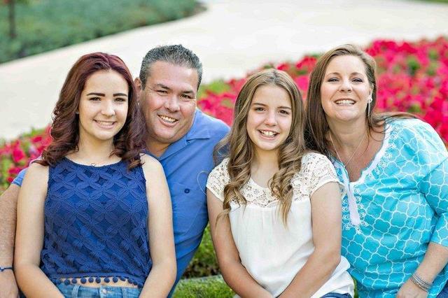 The Reed family poses for a photo at the JW Marriott in May. From left to right are Alexis, Michael, Emma and Christy. Michael has been a stay-at-home-dad for almost eight years. Special to View