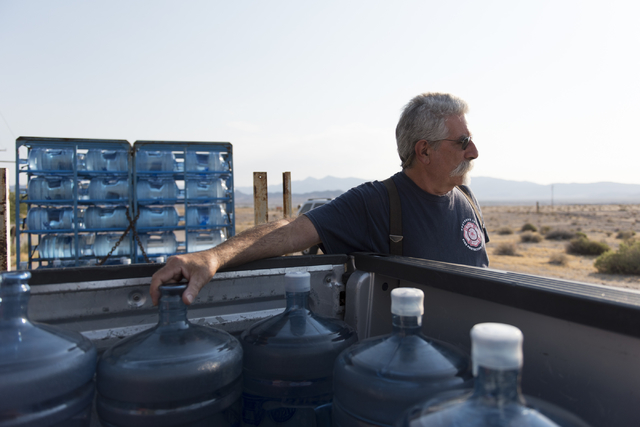 Larry Levy, fire chief with Southern Inyo Fire Protection District, makes his weekly potable water delivery rounds to residents in Tecopa, Calif. Tuesday, June 21, 2016. Jason Ogulnik/Las Vegas Re ...