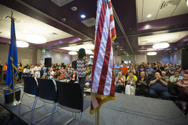 Muslim woman Saira Haseebullah speaks during a candle light vigil honoring victims of the Orlando mass shooting at the The Gay and Lesbian Community Center of Southern Nevada on Sunday, June 12, 2 ...